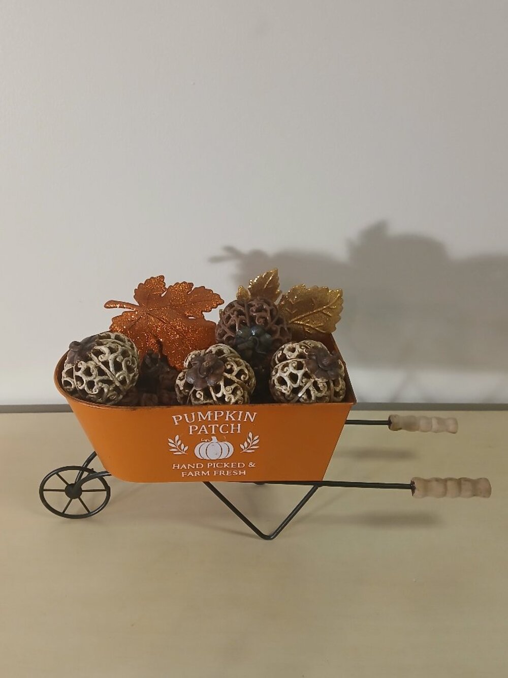 Metal pumpkin patch wheelbarrow with resin & jute pumpkins with leaves